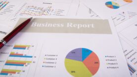 Business report. Graphs and charts. Business reports and pile of